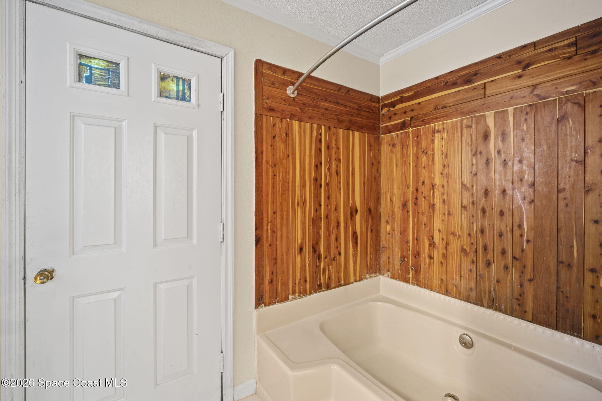 325 East Hall Road Merritt Island, FL 32953 - Photo 17 of 29 a bathroom with a tub and shower