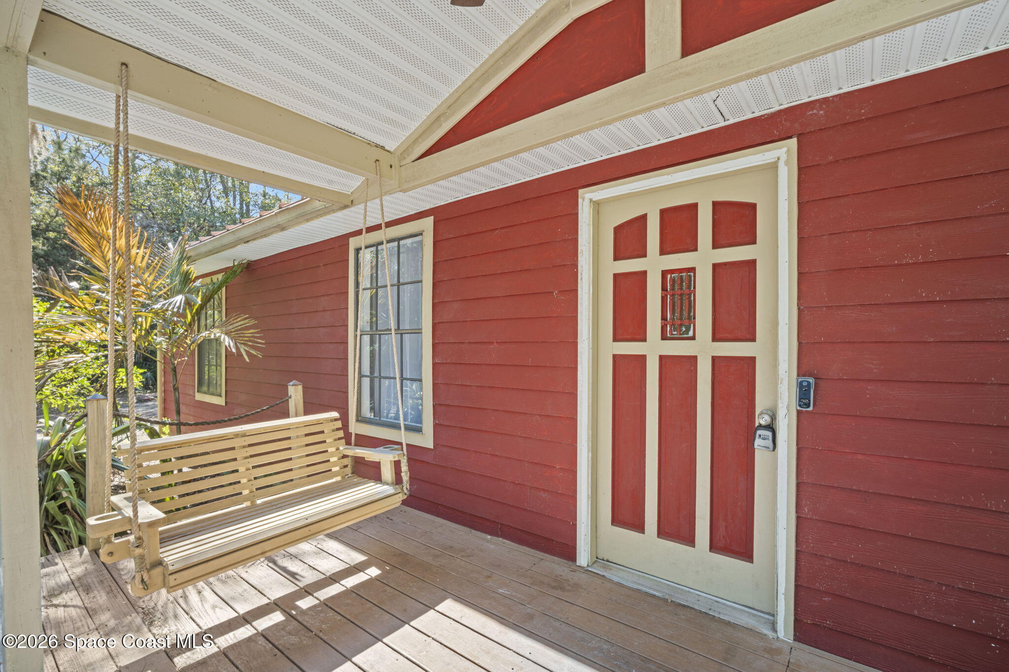 325 East Hall Road Merritt Island, FL 32953 - Photo 3 of 29 a view of a house with a door and wooden floor