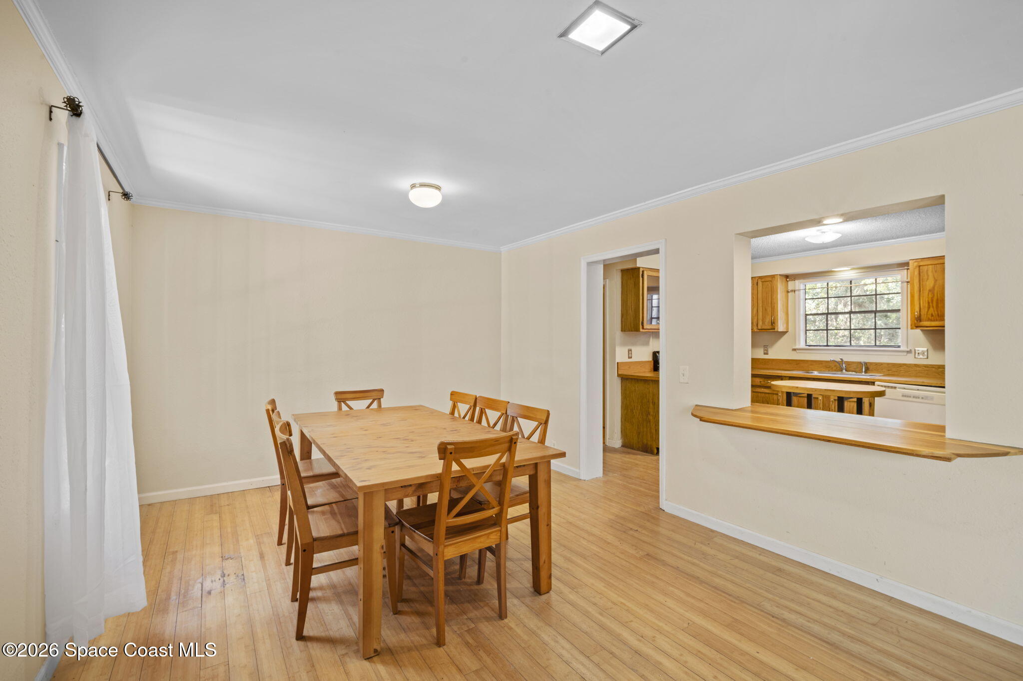 325 East Hall Road Merritt Island, FL 32953 - Photo 5 of 29 a view of a dining room with furniture and a window