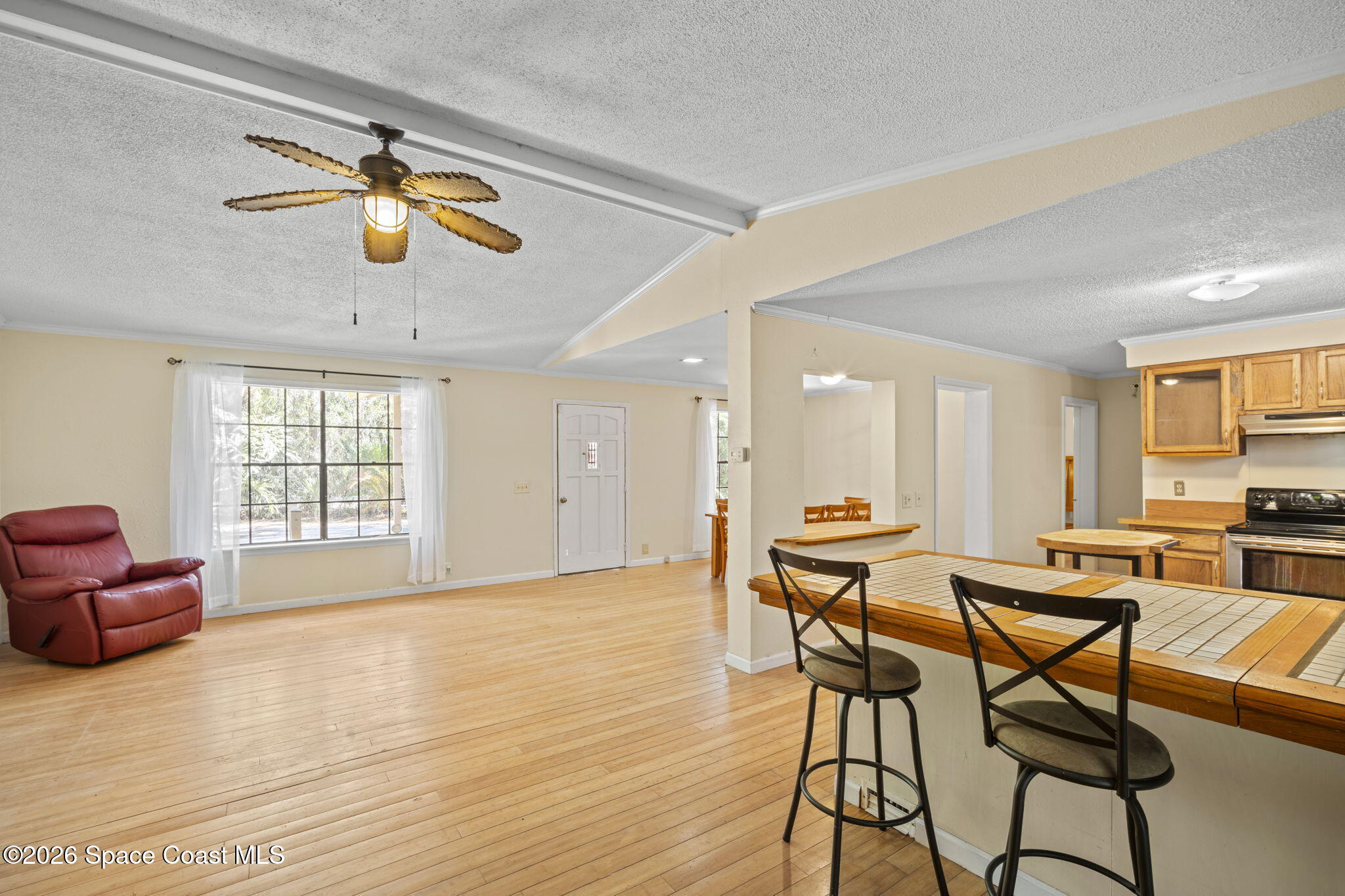 325 East Hall Road Merritt Island, FL 32953 - Photo 8 of 29 a view of a dining room with furniture and a window