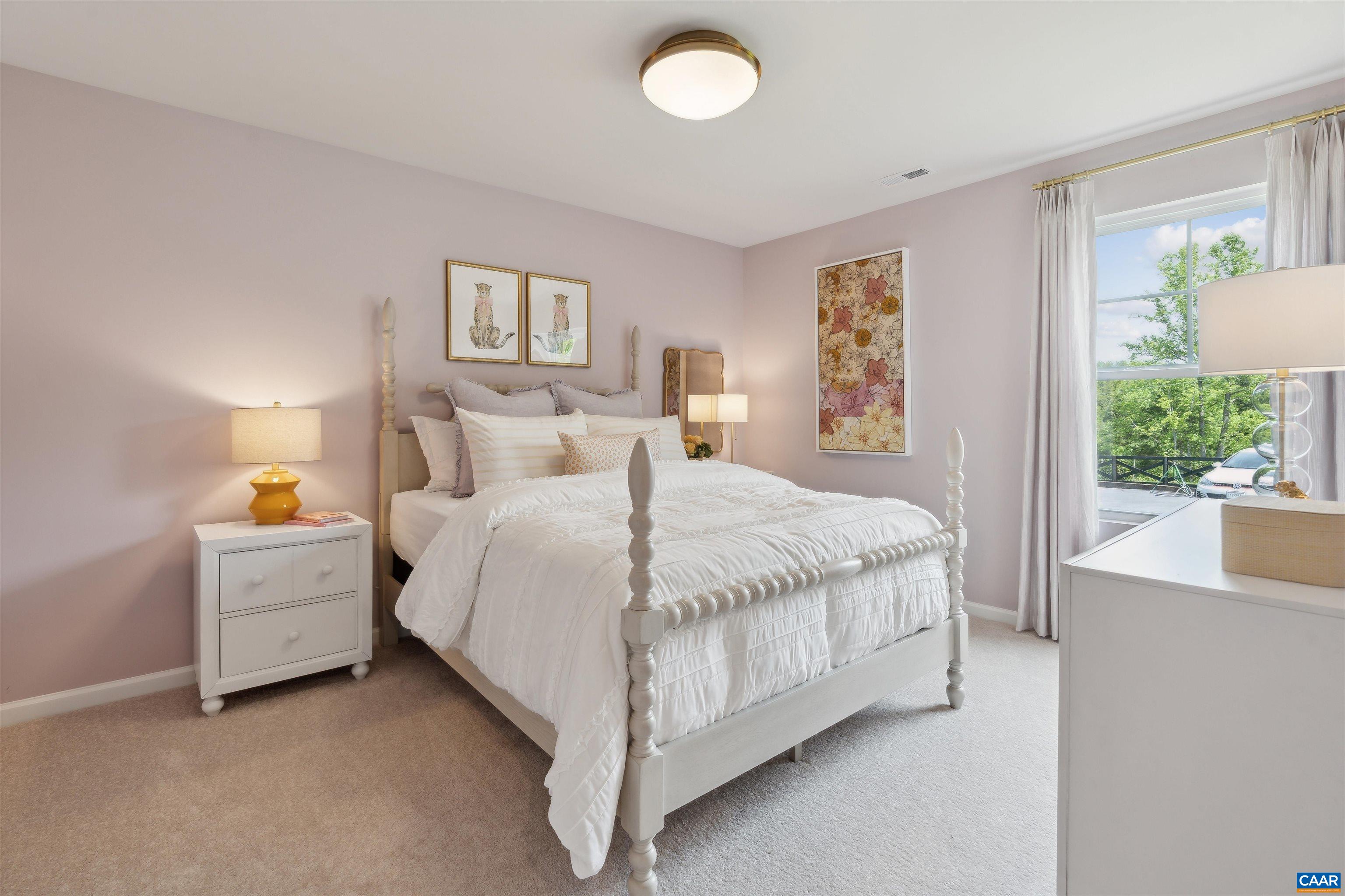 290 Trailfork Road Barboursville, VA 22923 - Photo 9 of 36 a spacious bedroom with a bed and a lamp on table