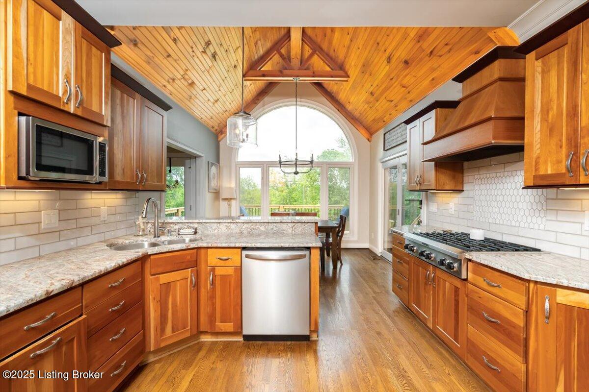 10801 Little Pond Road Goshen, KY 40026 - Photo 28 of 73 Natural wood tones magnify the beauty of this homes kitchen and breakfast area, complimented by abundant natural light and beautiful green views
