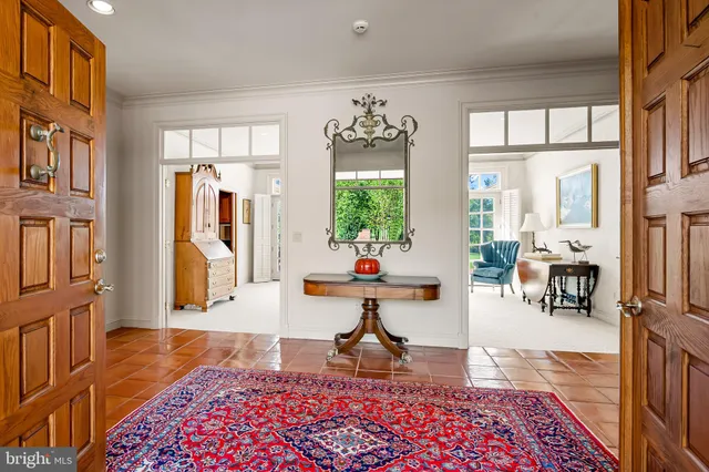 a kitchen with stainless steel appliances granite countertop a stove and a kitchen island