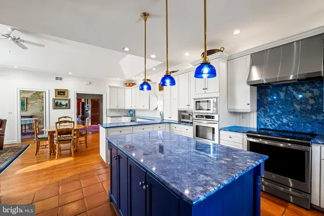 a front view of a house with garden and patio