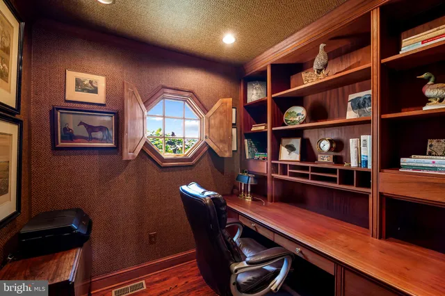 a view of a patio with table and chairs with wooden floor and fence