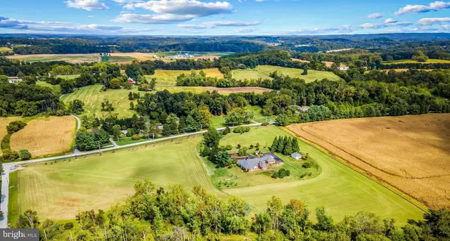 a view of a chairs and table in the patio
