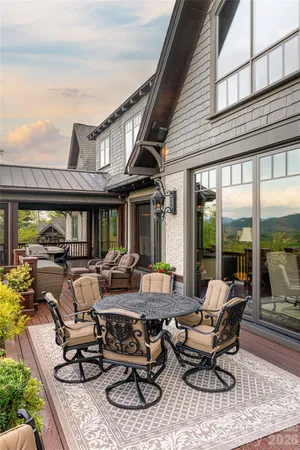 a building outdoor space with patio furniture and glass windows
