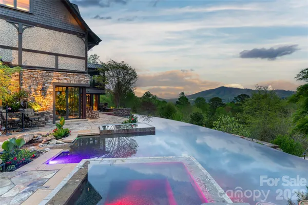 a view of swimming pool with outdoor seating