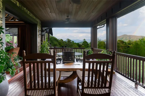 a view of a balcony with furniture