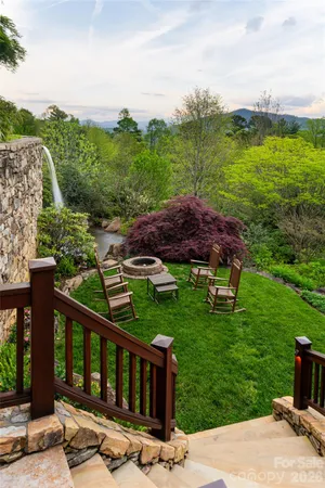 a view of a garden with an outdoor seating