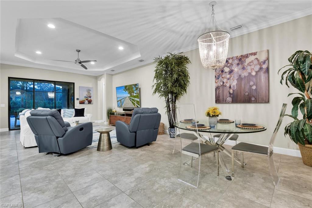 9630 Campanile Circle Naples, FL 34114 - Photo 11 of 31 a living room with furniture and a large window