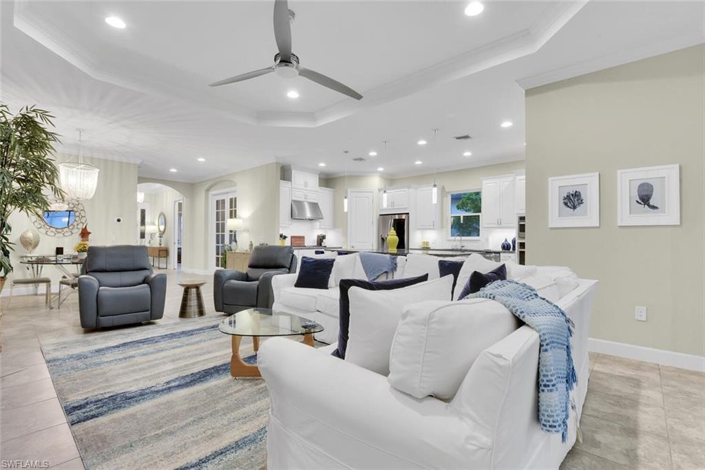 9630 Campanile Circle Naples, FL 34114 - Photo 13 of 31 a living room with lots of furniture and a table