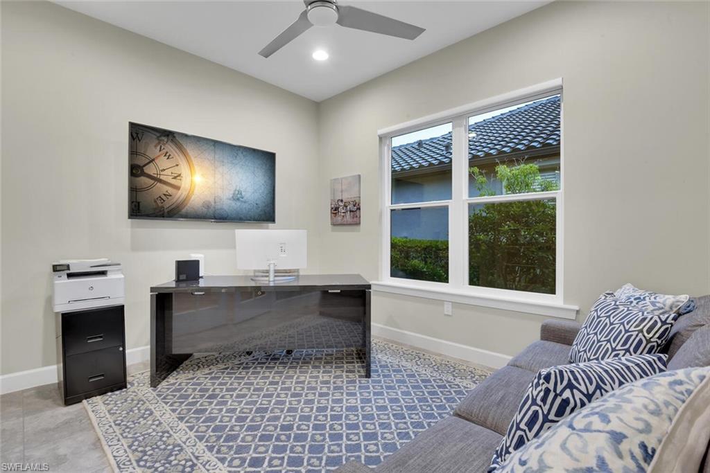 9630 Campanile Circle Naples, FL 34114 - Photo 14 of 31 a living room with furniture and a flat screen tv