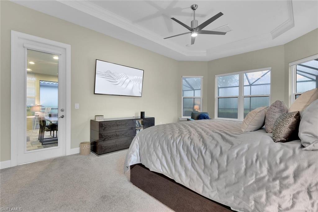 9630 Campanile Circle Naples, FL 34114 - Photo 15 of 31 a bedroom with a bed and a couch