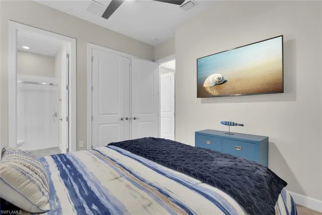 a bedroom with a bed and a bathroom