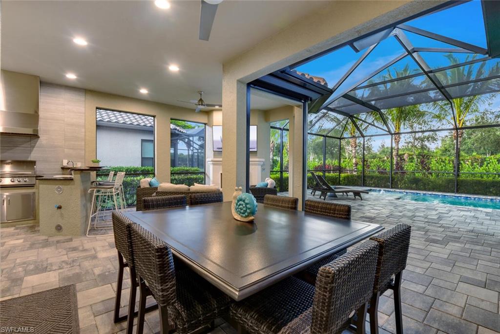 9630 Campanile Circle Naples, FL 34114 - Photo 28 of 31 a view of a dining table and chairs in the kitchen