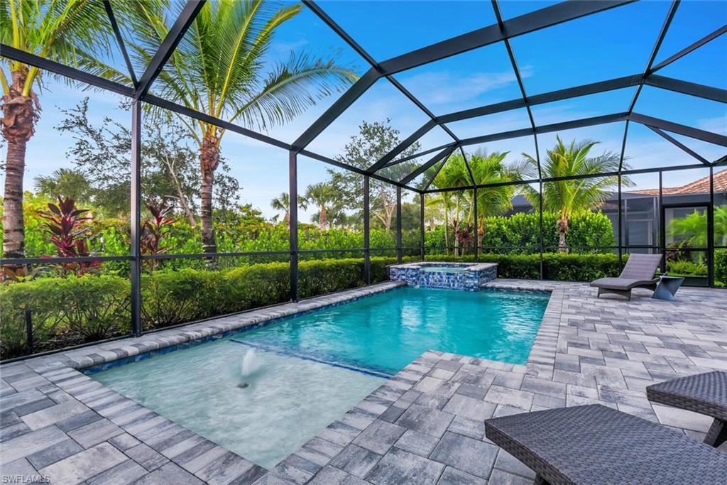 9630 Campanile Circle Naples, FL 34114 - Photo 31 of 31 a view of a swimming pool with a patio