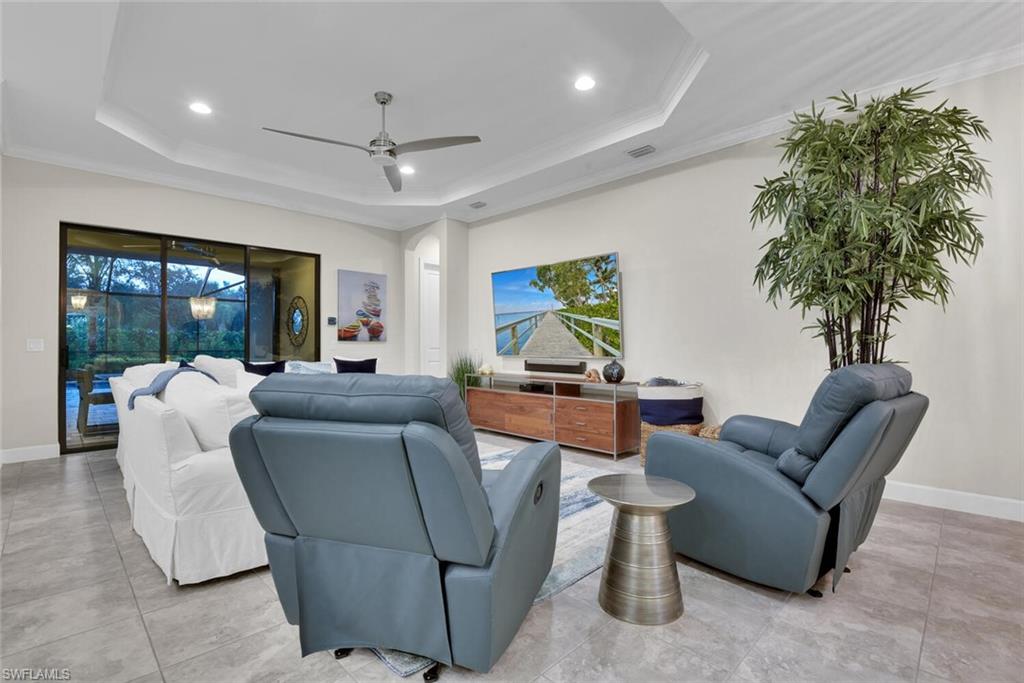 9630 Campanile Circle Naples, FL 34114 - Photo 10 of 31 a living room with furniture and a potted plant