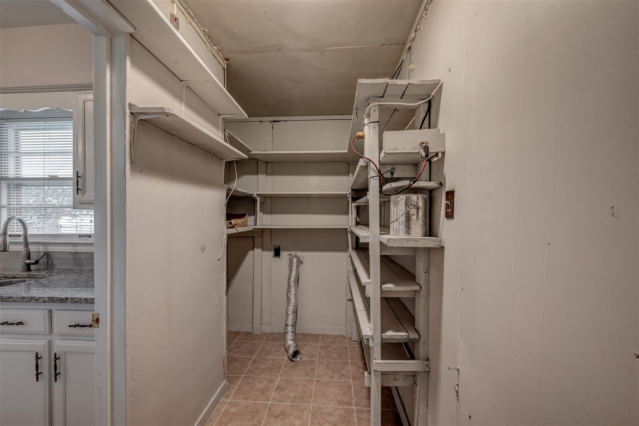 1645 Welsh Road Memphis, TN 38117 - Photo 12 of 18 a view of walk in closet with empty racks