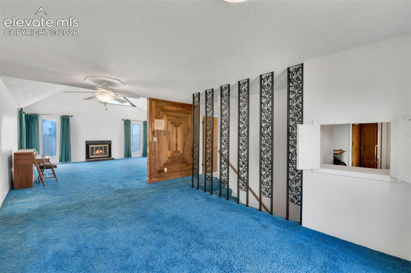 24975 Sanborn Road Calhan, CO 80808 - Photo 12 of 50 dining room looking into the living room. stairs to the basement are on the right. Passthrough to the kitchen