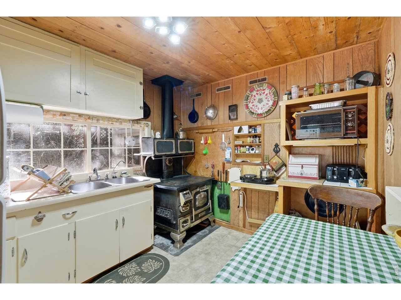 2476 Riverside Drive Lyons, CO 80540 - Photo 10 of 42 a kitchen with stainless steel appliances a stove and cabinets