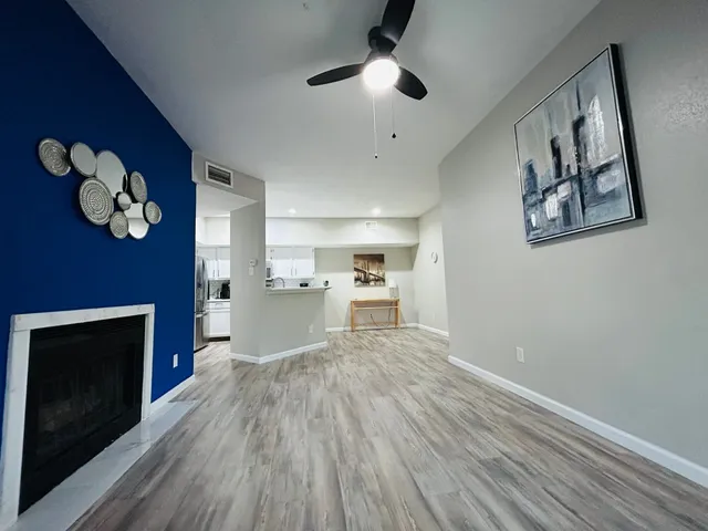 a view of a kitchen with a stove cabinets and wooden floor