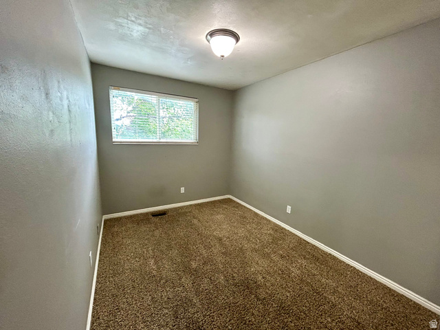 441 South 400 East Payson, UT 84651 - Photo 17 of 39 Light-filled interior space featuring neutral wall tones and a window with horizontal blinds