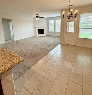 a view of a kitchen with microwave and cabinets