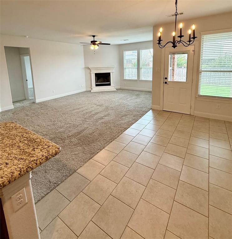 204 Flower Ridge Drive Fort Worth, TX 76108 - Photo 17 of 27 a view of an empty room with window and cabinet