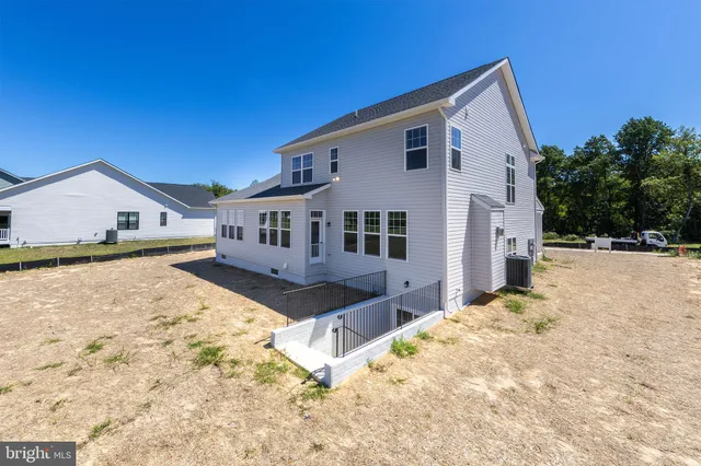 a view of house with yard