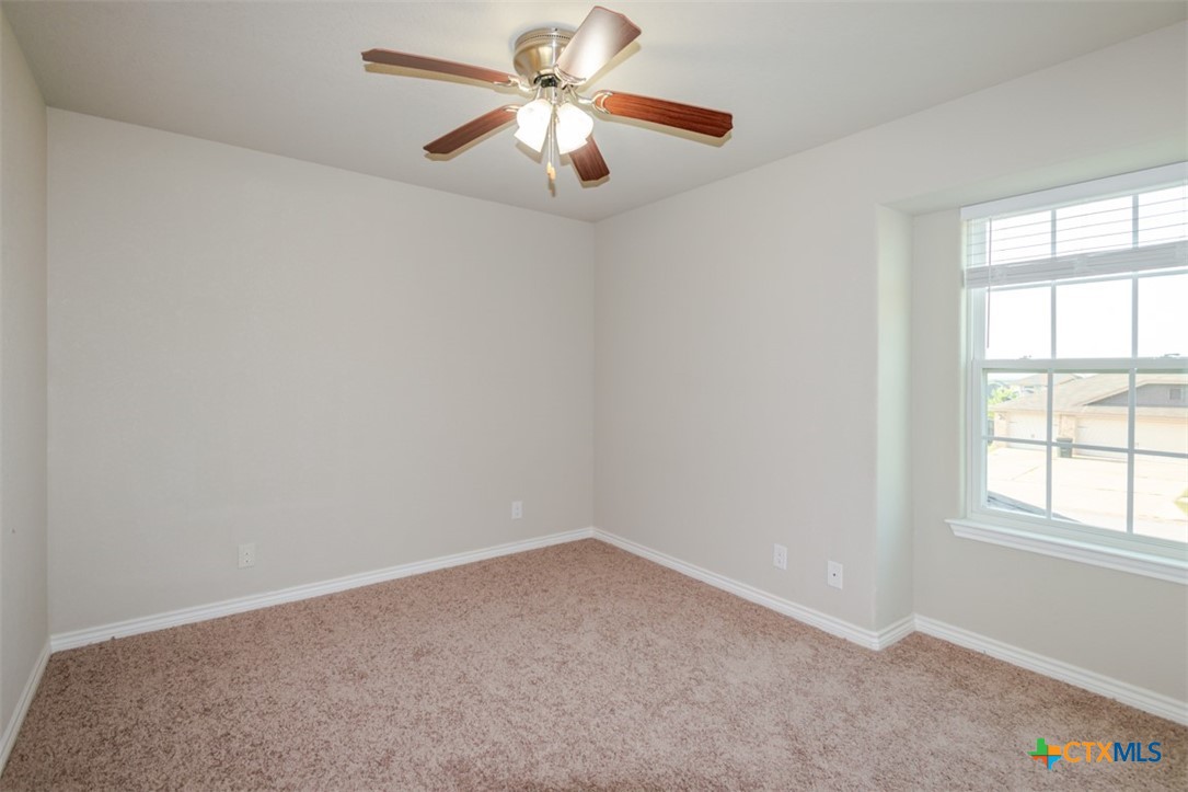 2601 Tarrant County Drive Killeen, TX 76549 - Photo 24 of 35 an empty room with a window and a fan