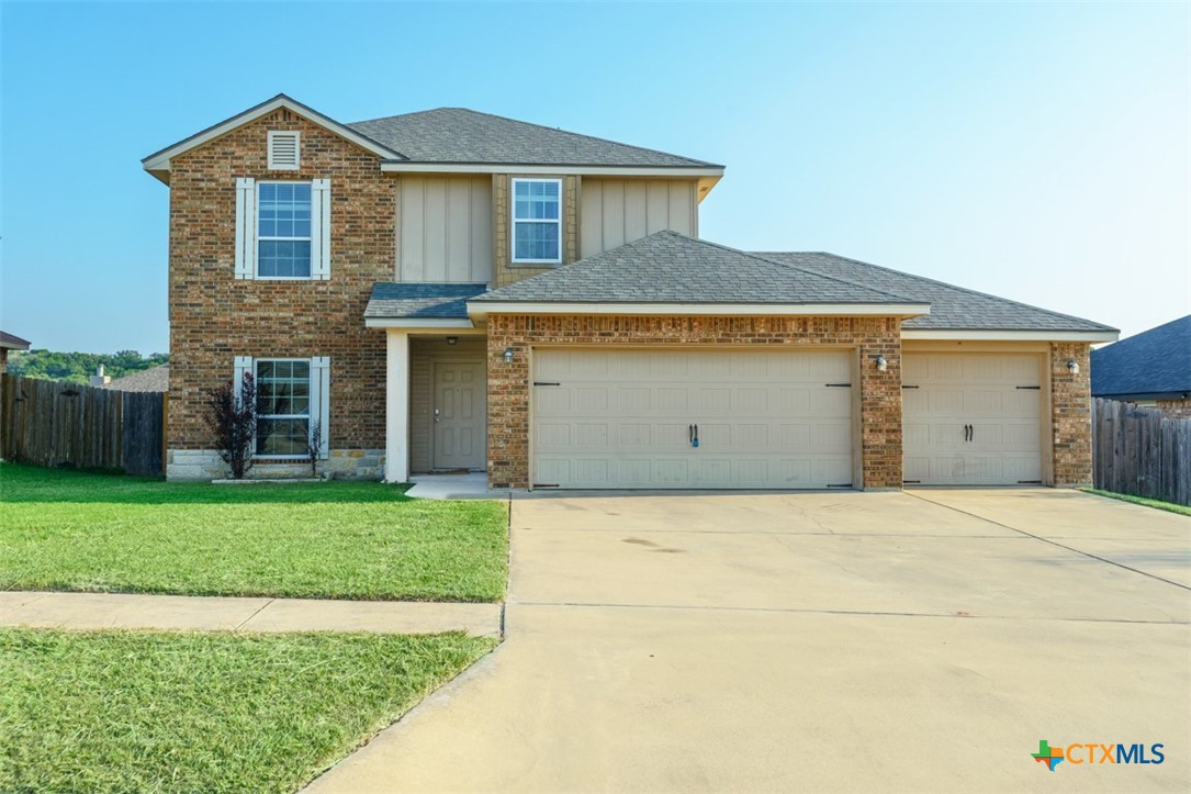 2601 Tarrant County Drive Killeen, TX 76549 - Photo 28 of 35 a front view of a house with a yard and garage