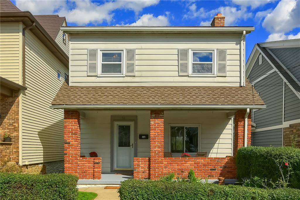 Front of home with covered porch with concrete floor
