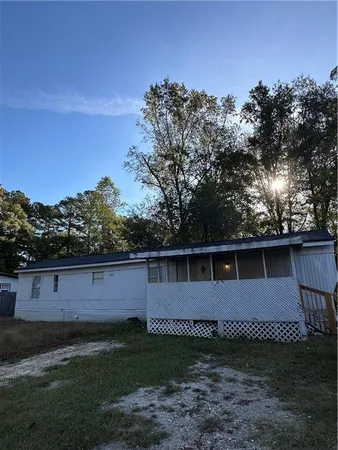 a view of back yard with green space