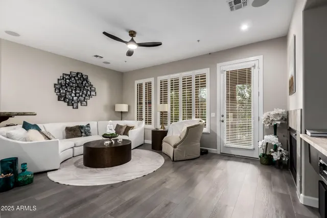 a living room with furniture and a large window