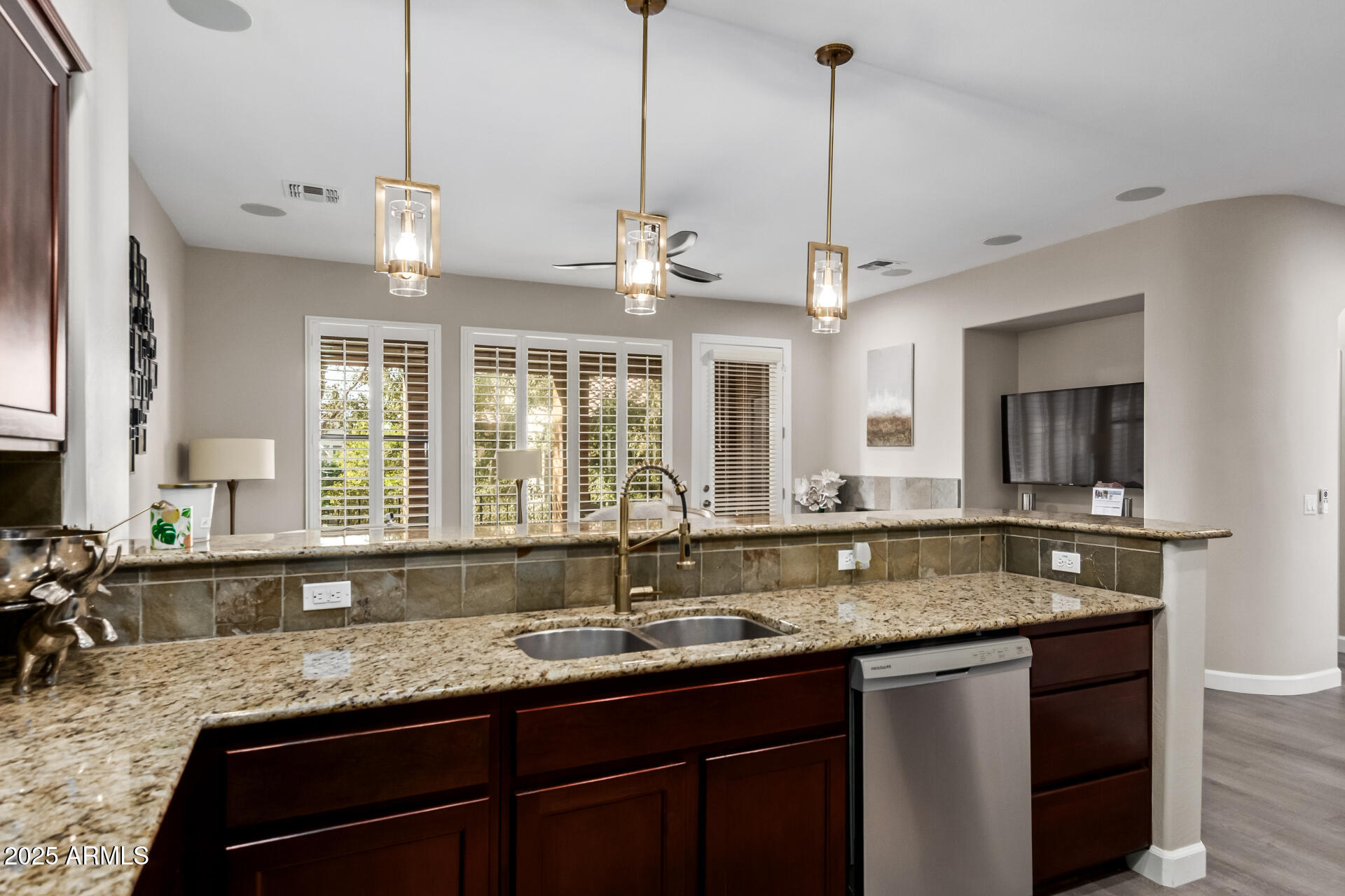 4777 South Fulton Ranch Boulevard, Unit 2035 Chandler, AZ 85248 - Photo 13 of 38 a kitchen with center island and large windows