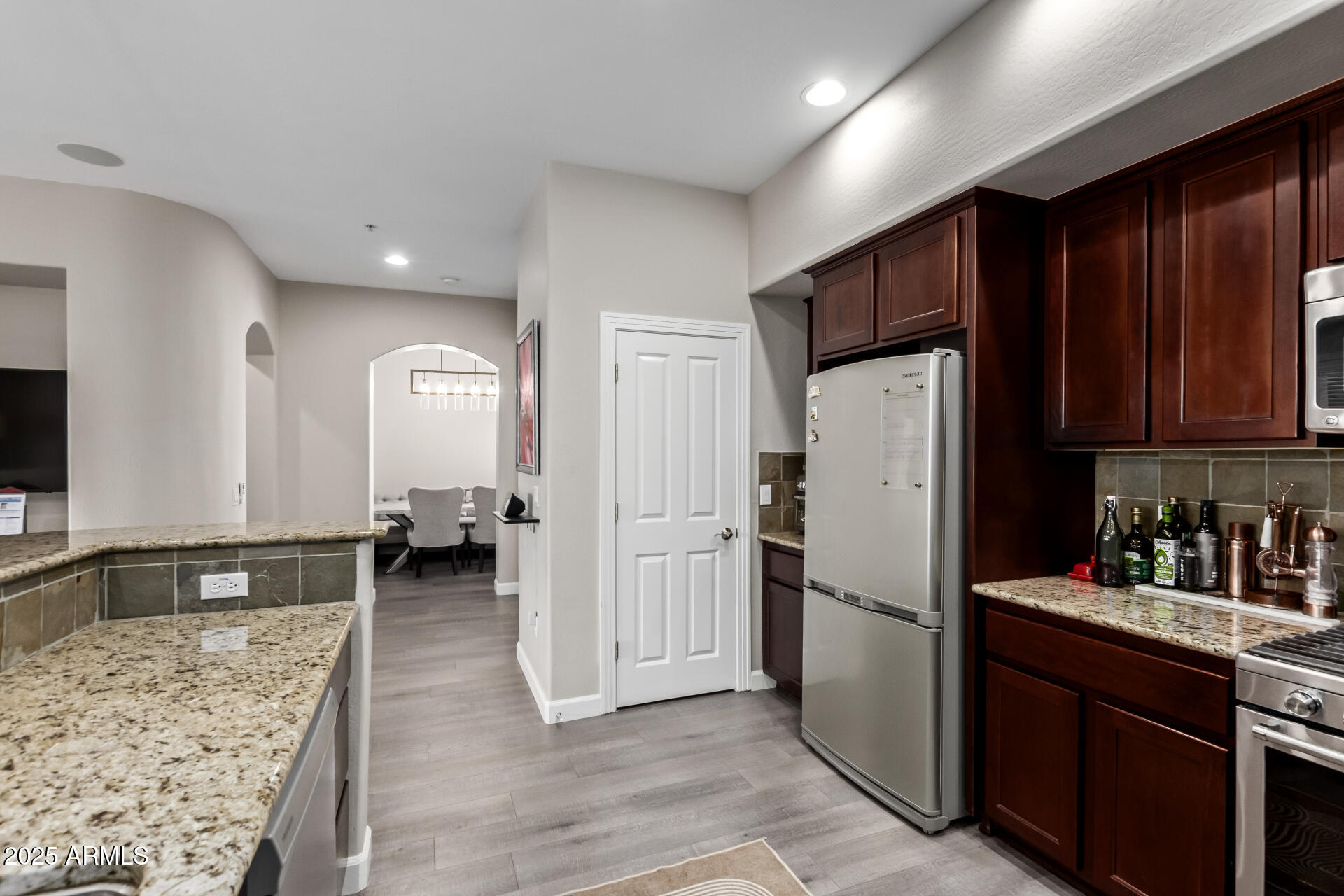 4777 South Fulton Ranch Boulevard, Unit 2035 Chandler, AZ 85248 - Photo 14 of 38 a kitchen with refrigerator and cabinets
