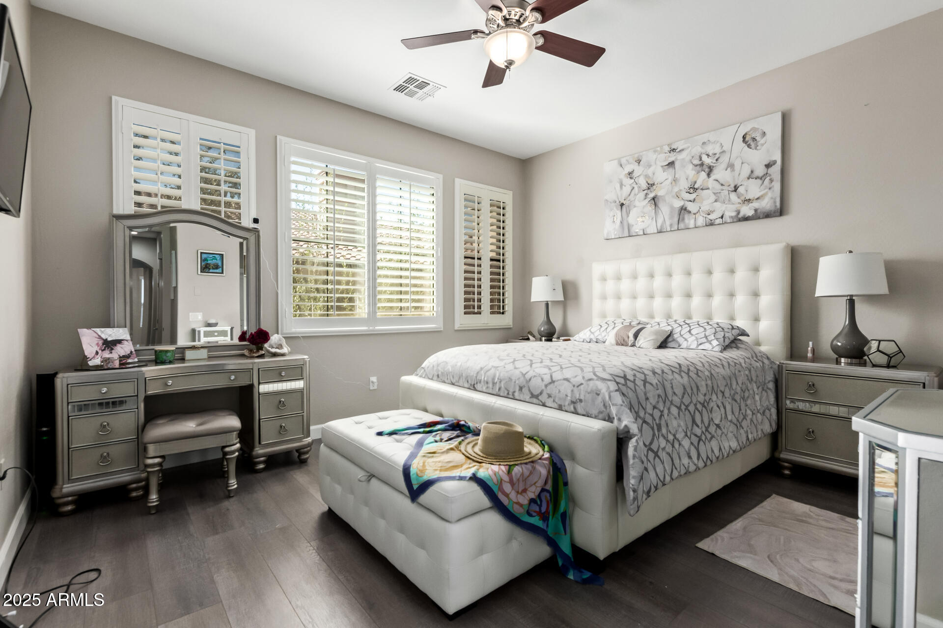 4777 South Fulton Ranch Boulevard, Unit 2035 Chandler, AZ 85248 - Photo 15 of 38 a bedroom with a bed and a chandelier