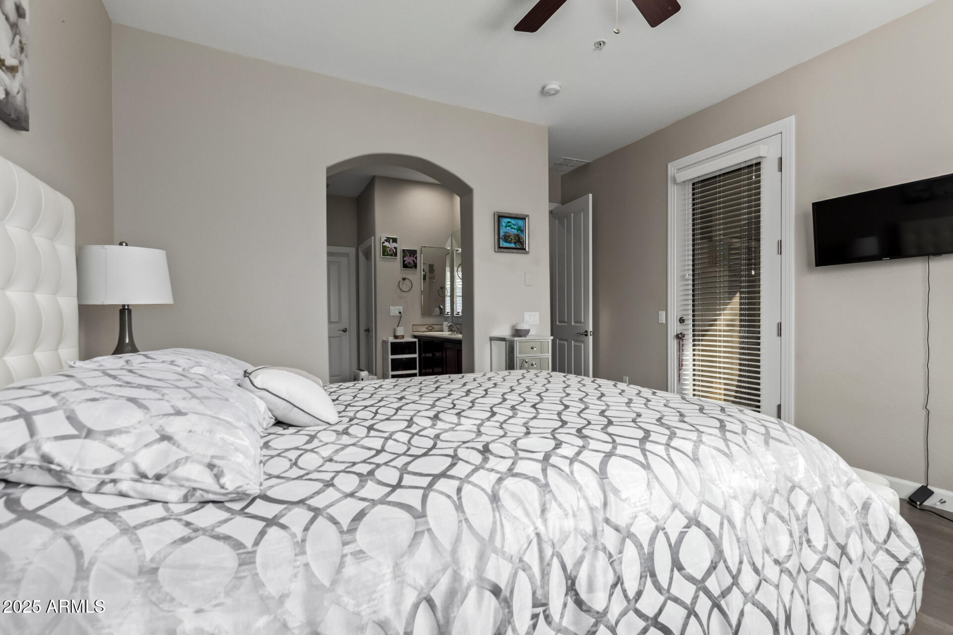 4777 South Fulton Ranch Boulevard, Unit 2035 Chandler, AZ 85248 - Photo 17 of 38 a bedroom with a bed and a flat screen tv