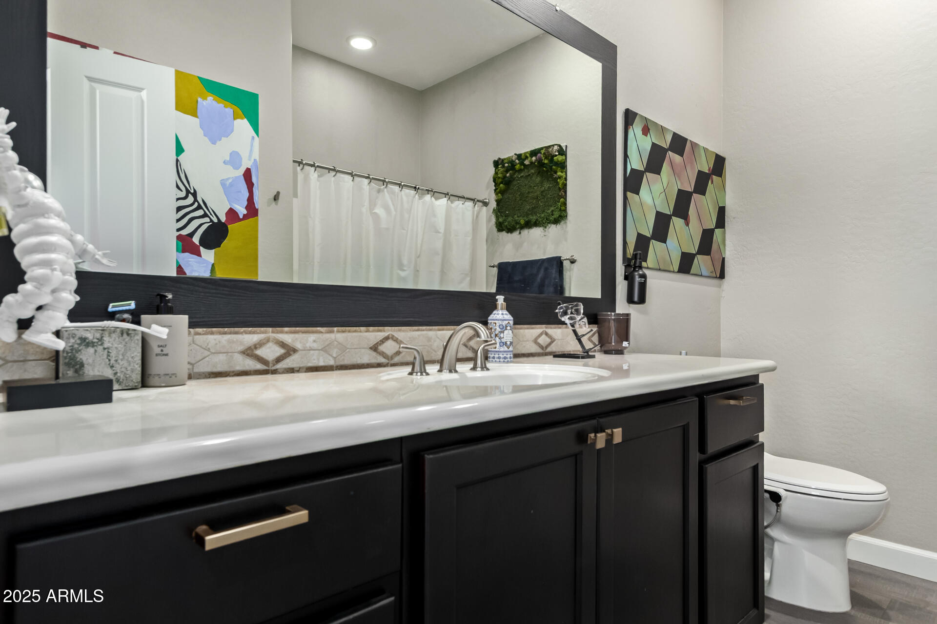 4777 South Fulton Ranch Boulevard, Unit 2035 Chandler, AZ 85248 - Photo 23 of 38 a bathroom with a toilet sink and mirror