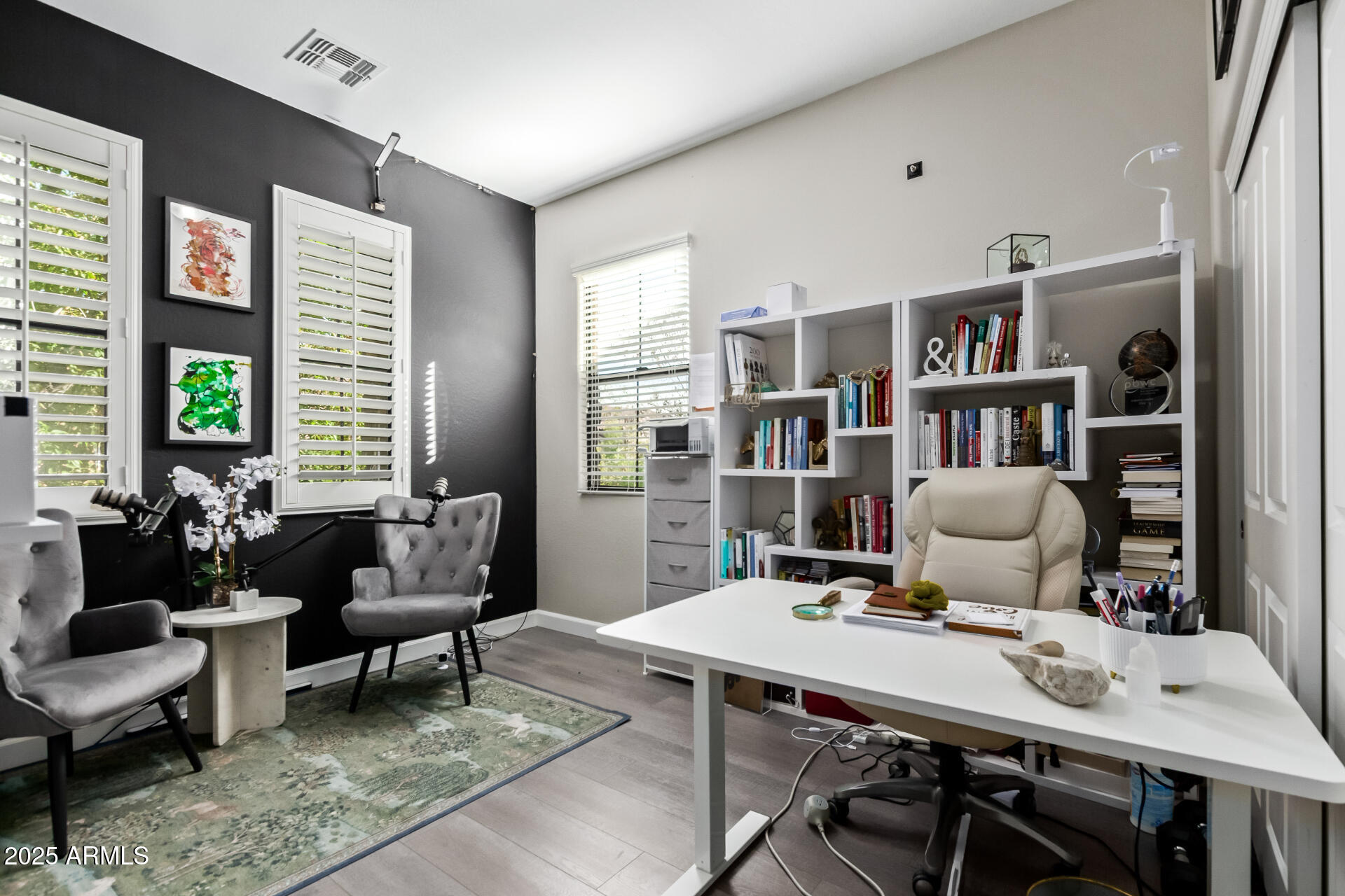 4777 South Fulton Ranch Boulevard, Unit 2035 Chandler, AZ 85248 - Photo 25 of 38 a workspace with furniture and a book shelf