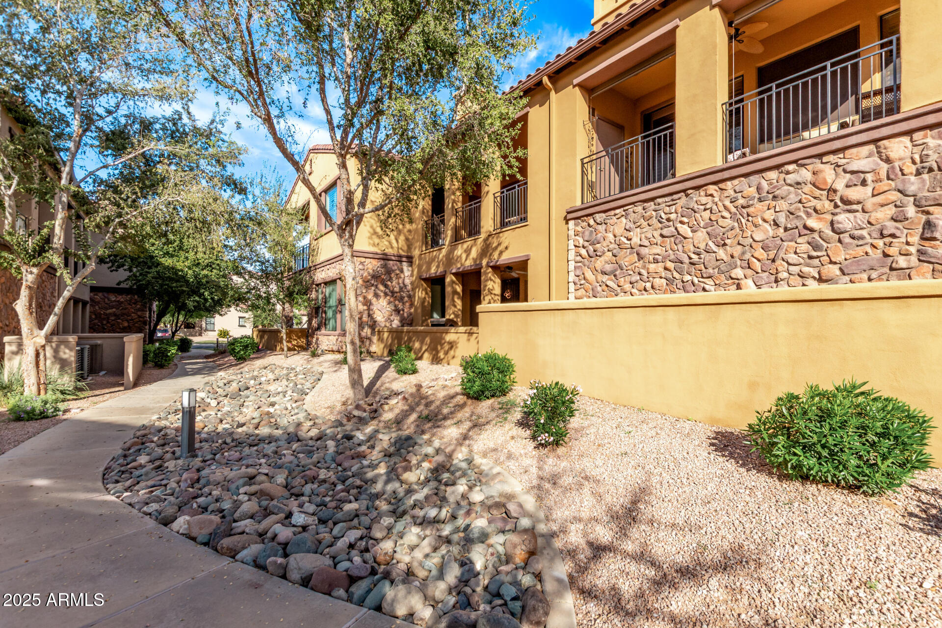 4777 South Fulton Ranch Boulevard, Unit 2035 Chandler, AZ 85248 - Photo 31 of 38 a view of a yard with a house