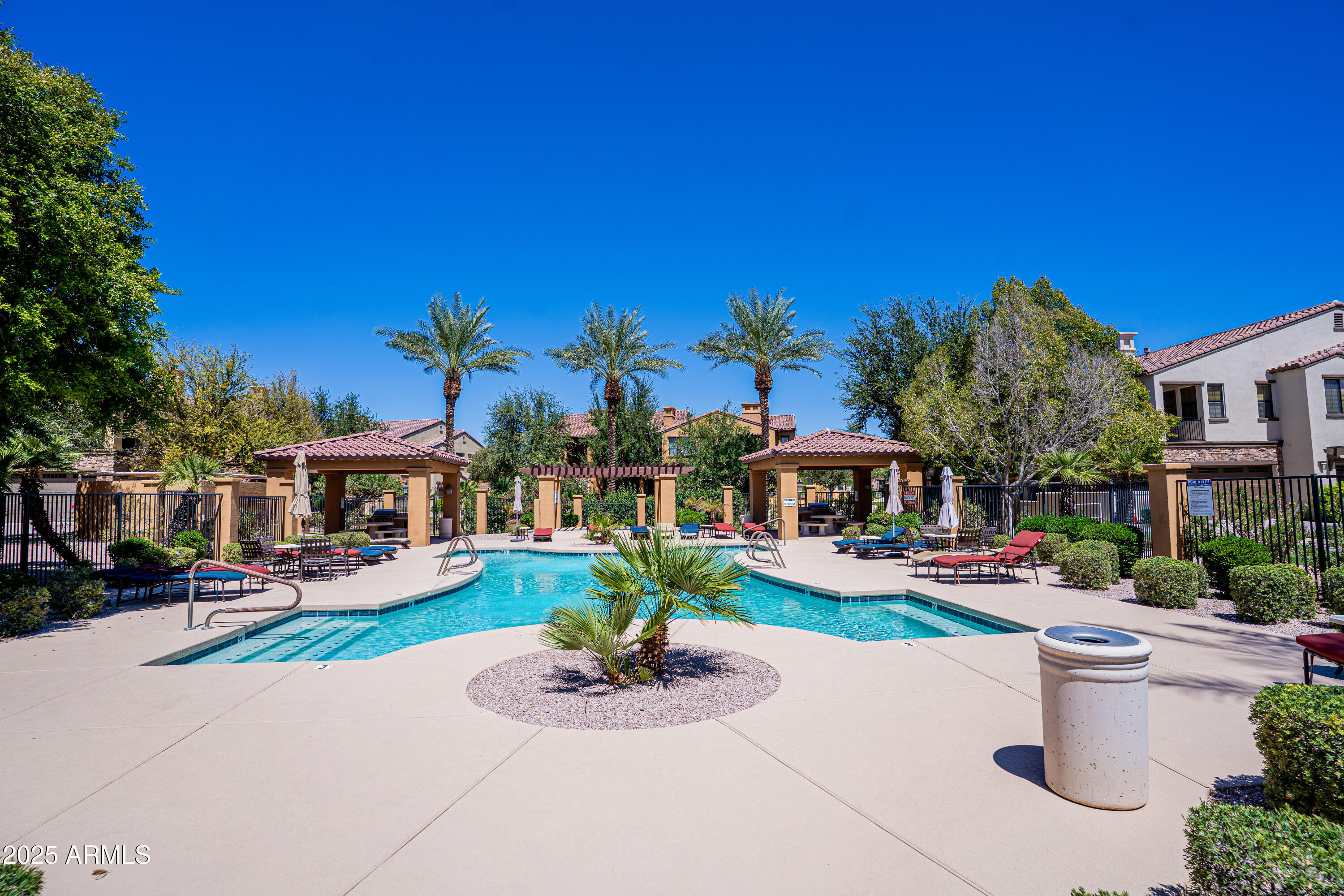4777 South Fulton Ranch Boulevard, Unit 2035 Chandler, AZ 85248 - Photo 33 of 38 a front view of a house with garden and trees