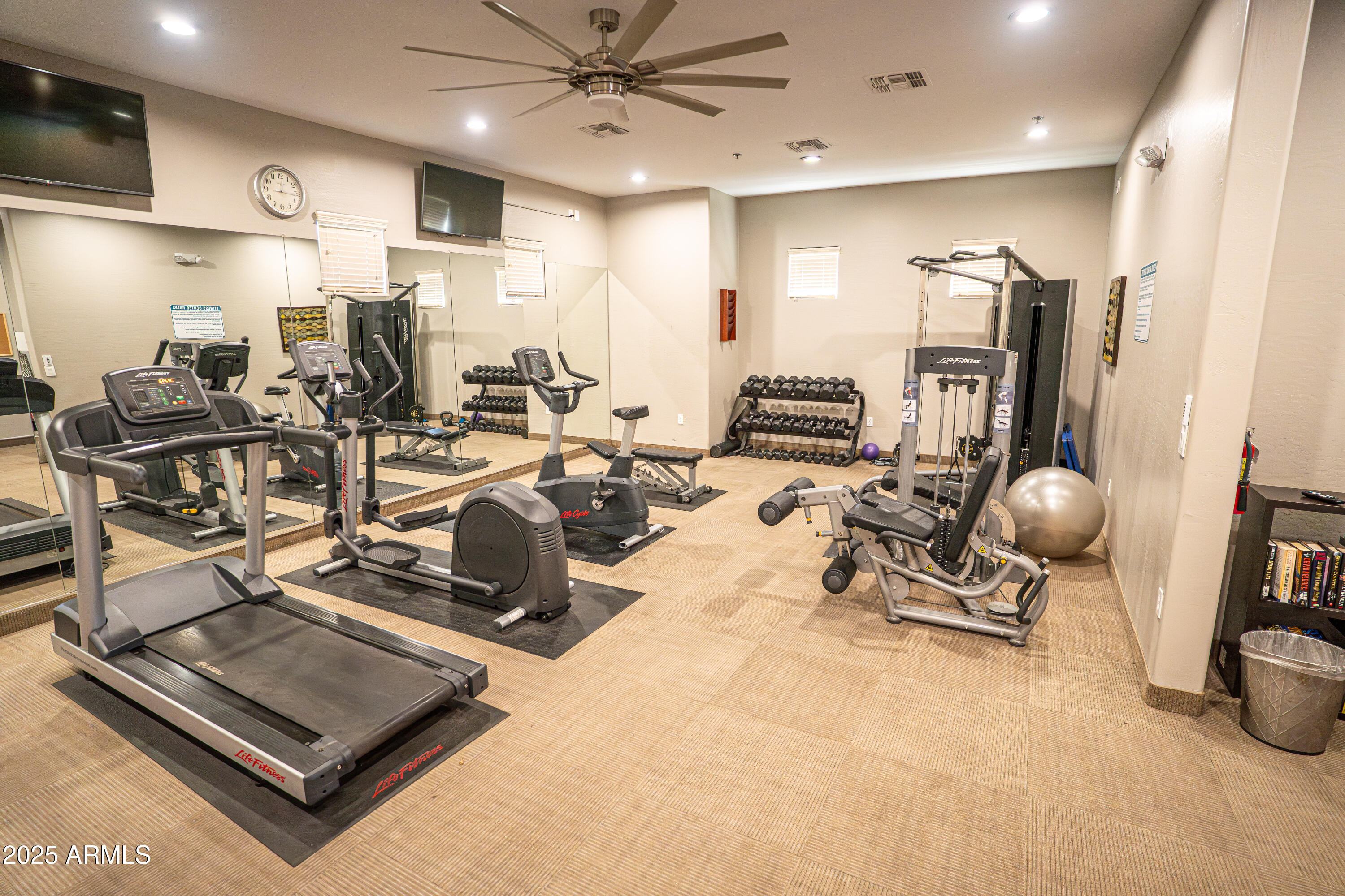 4777 South Fulton Ranch Boulevard, Unit 2035 Chandler, AZ 85248 - Photo 34 of 38 a room with gym equipment and a view of living room