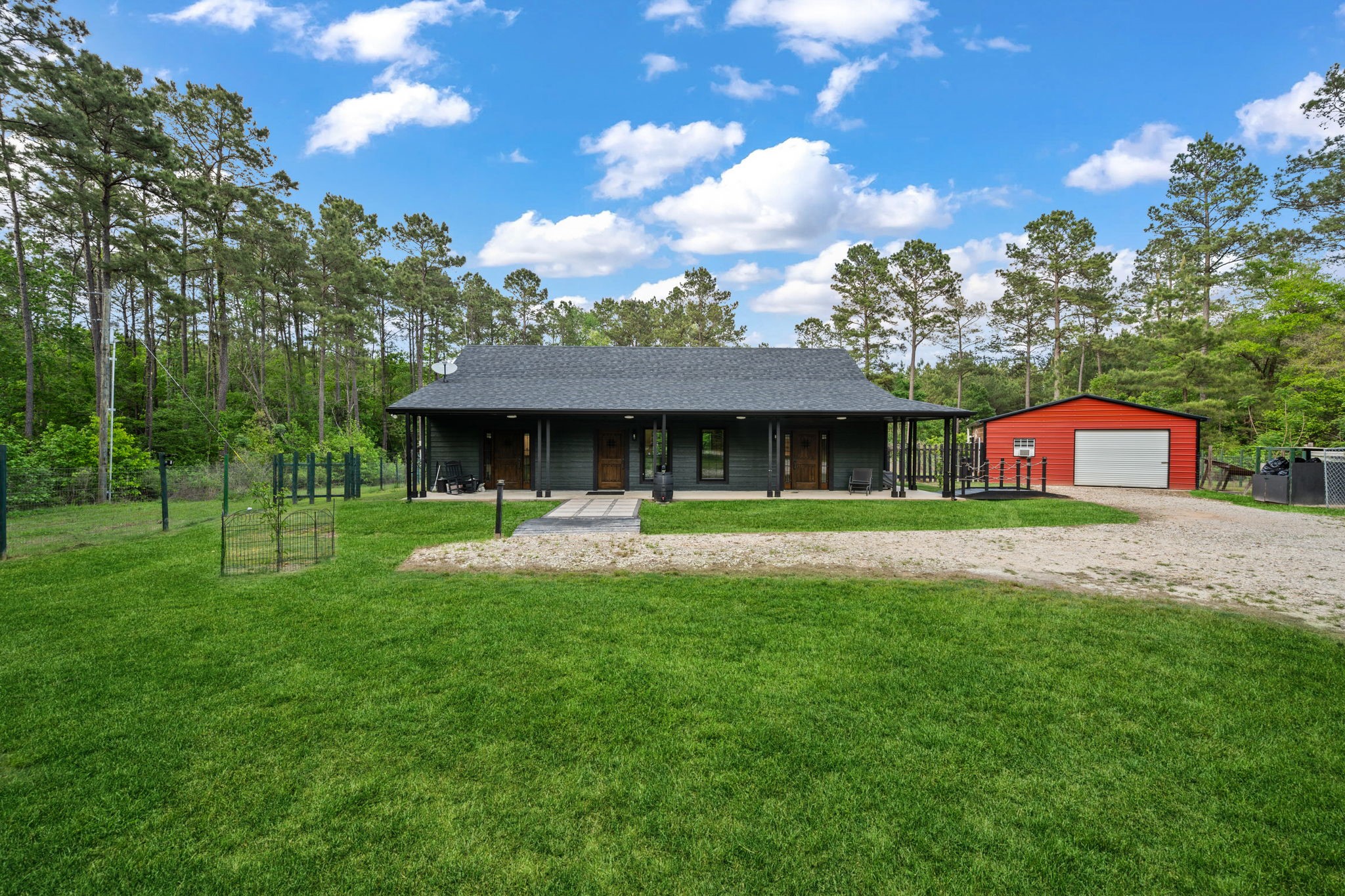 625-635 Gibson Road Livingston, TX 77351 - Photo 5 of 49 Home #2 has a fully enclosed metal garage with workshop and fully fenced and gated yard. Backyard is separately fenced for pets.