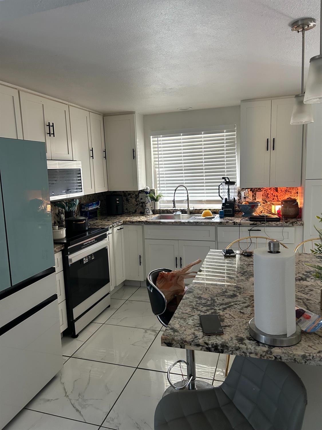 629 E Fort Modesto, CA 95354 - Photo 4 of 16 a kitchen with a sink stove and cabinets
