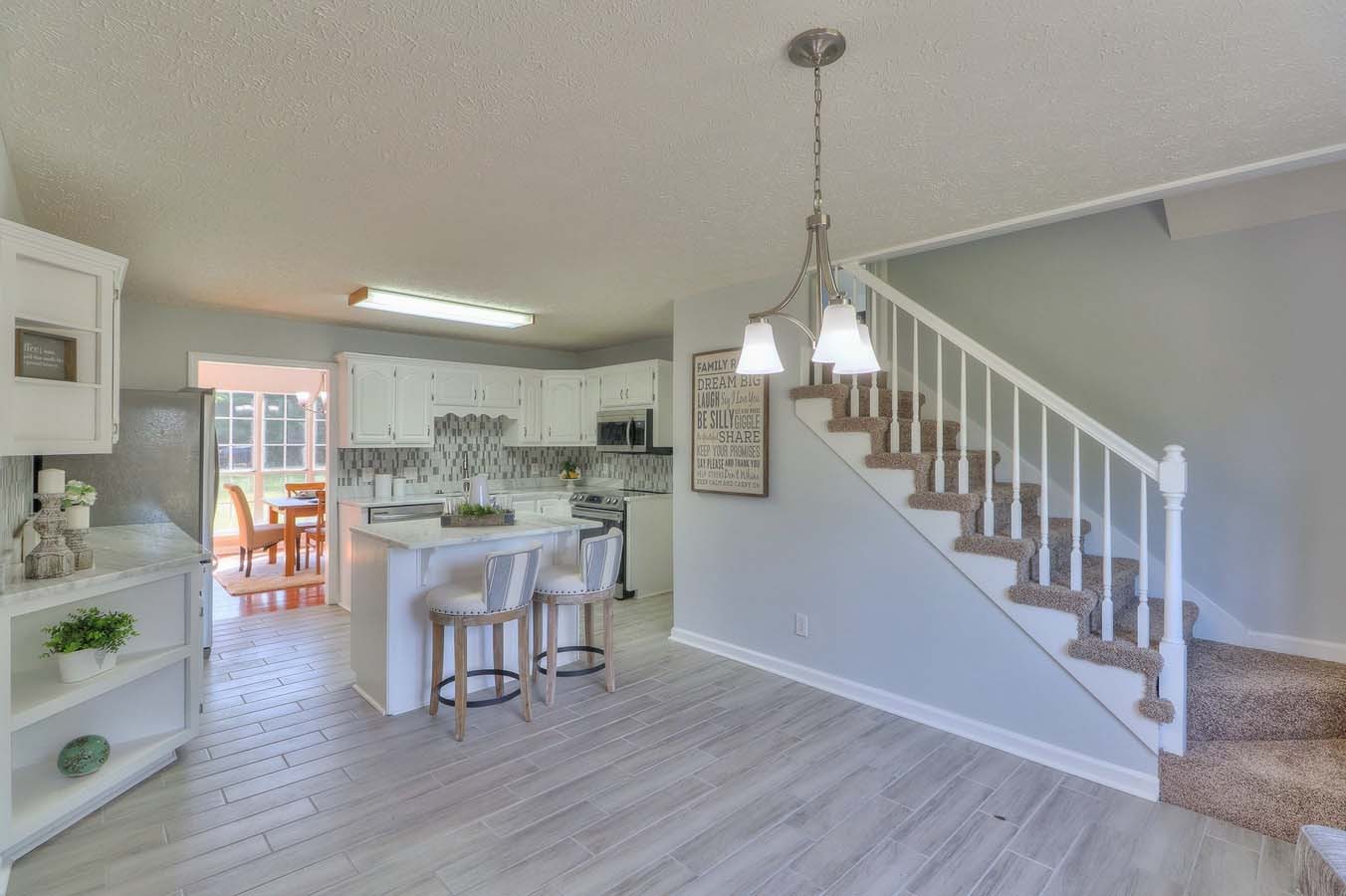 2891 Sulphur Springs Road Murfreesboro, TN 37129 - Photo 13 of 31 a dining room with furniture wooden floor and a chandelier