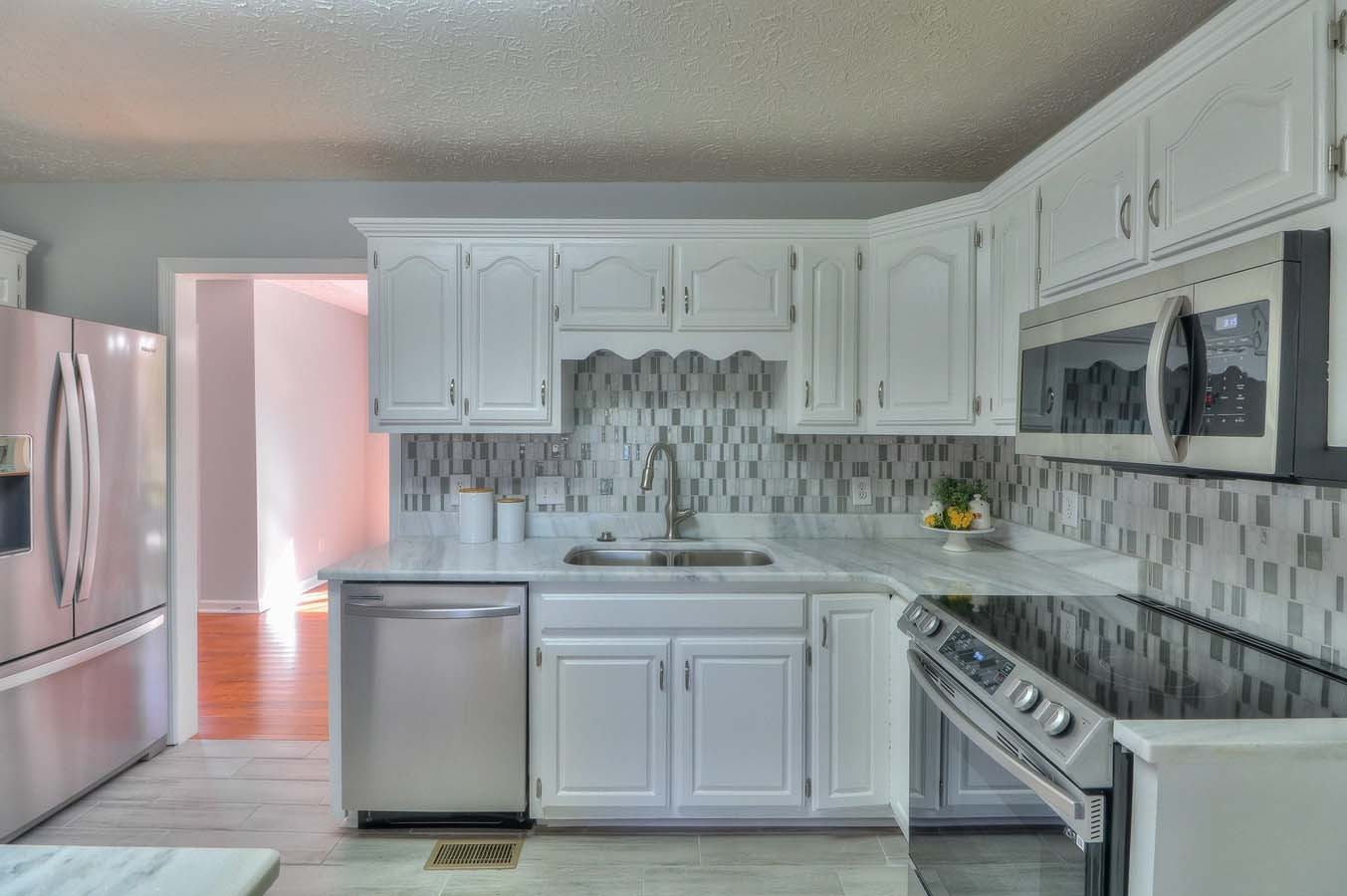 2891 Sulphur Springs Road Murfreesboro, TN 37129 - Photo 14 of 31 a kitchen with stainless steel appliances granite countertop a sink stove and refrigerator