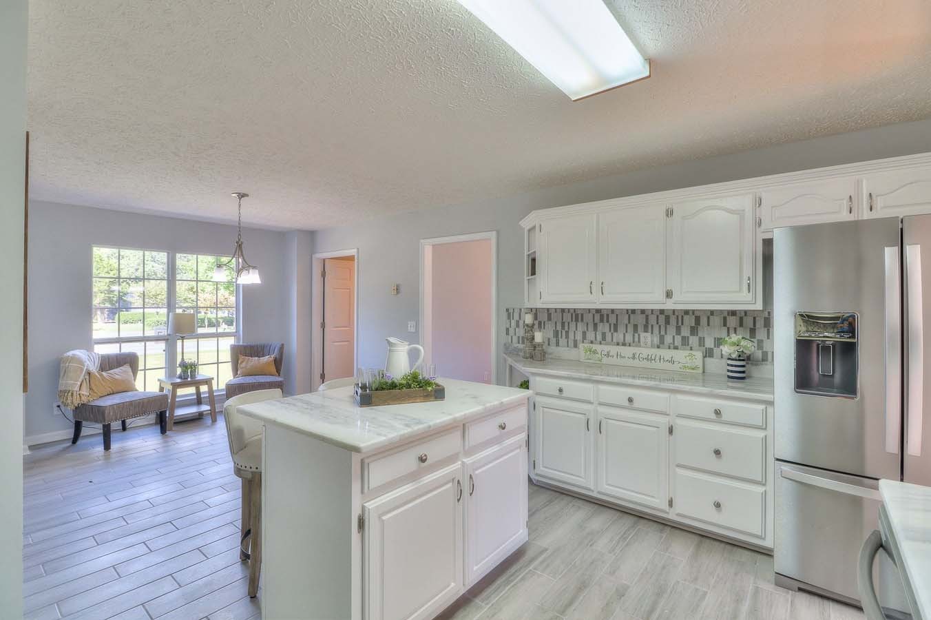 2891 Sulphur Springs Road Murfreesboro, TN 37129 - Photo 16 of 31 a kitchen with white cabinets and appliances
