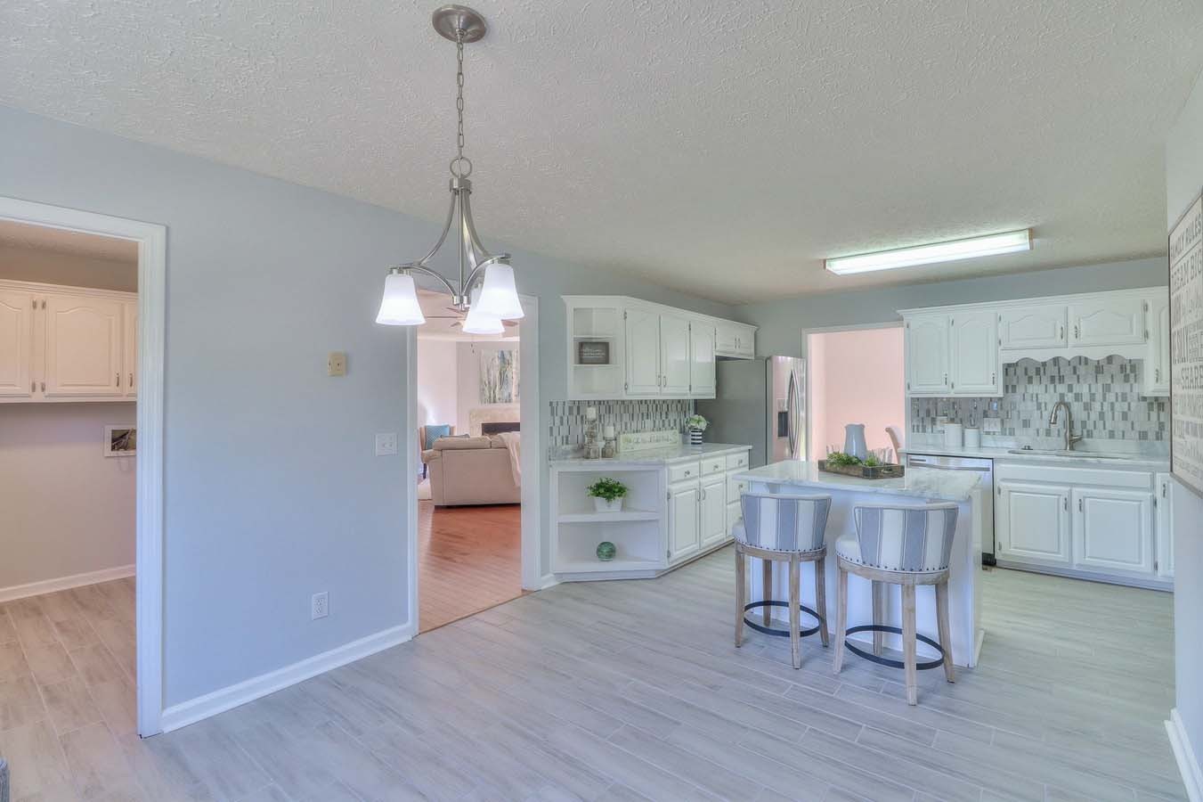 2891 Sulphur Springs Road Murfreesboro, TN 37129 - Photo 17 of 31 a open kitchen with white cabinets and white appliances